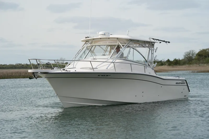 Slide: The Image of 2009 Grady-White Express 330 boat cruising on calm water. - 5