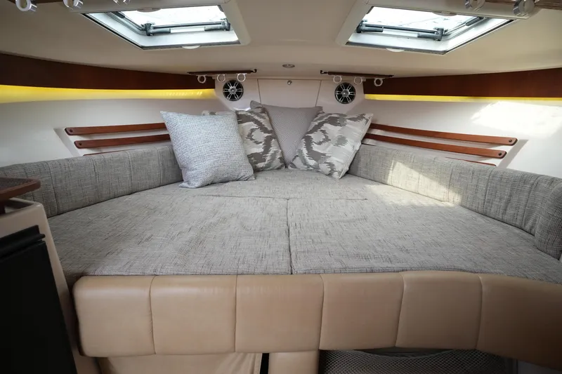 Slide: The Image of Luxurious cabin interior of 2009 Grady-White Express 330 boat with plush seating and cushions. - 53