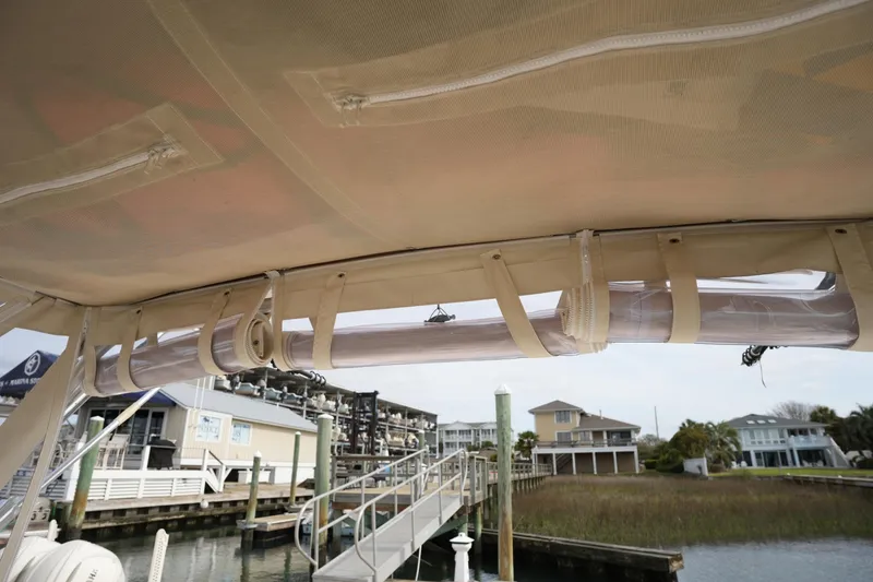 Slide: The Image of 2009 Grady-White Express 330 boat canopy with dockside view. - 63
