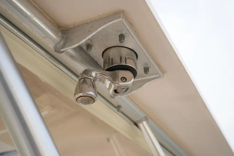 Slide: The Image of Chrome latch mechanism on 2009 Grady-White Express 330 boat. - 64