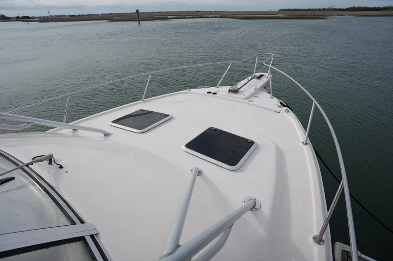 Slide: The Image of 2009 Grady-White Express 330 boat deck on calm water. - 66