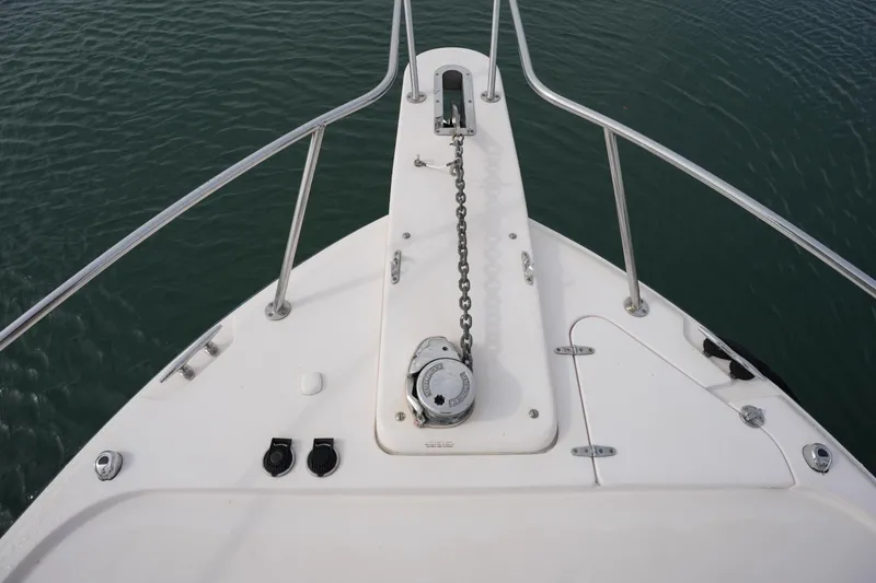Slide: The Image of Bow view of 2009 Grady-White Express 330 boat with anchor chain and railing. - 67