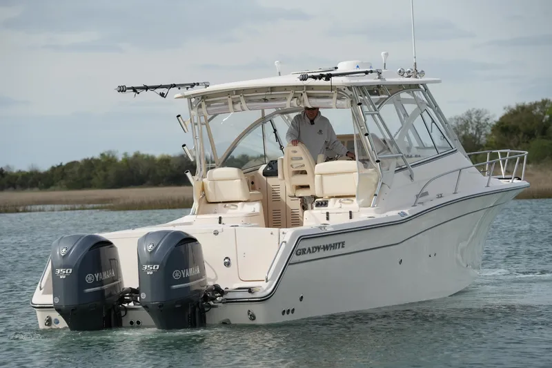 Slide: The Image of 2009 Grady-White Express 330 boat with twin Yamaha 350 engines on water. - 7