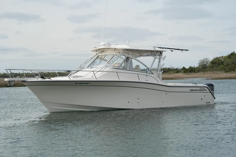 Slide: The Image of 2009 Grady-White Express 330 boat cruising on calm water. - 9