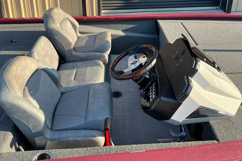 Slide: The Image of 2024 Avid 20 XB boat interior with dual seats and steering console. - 13