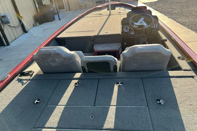 Slide: The Image of 2024 Avid 20 XB boat interior with dual seats and steering console. - 14