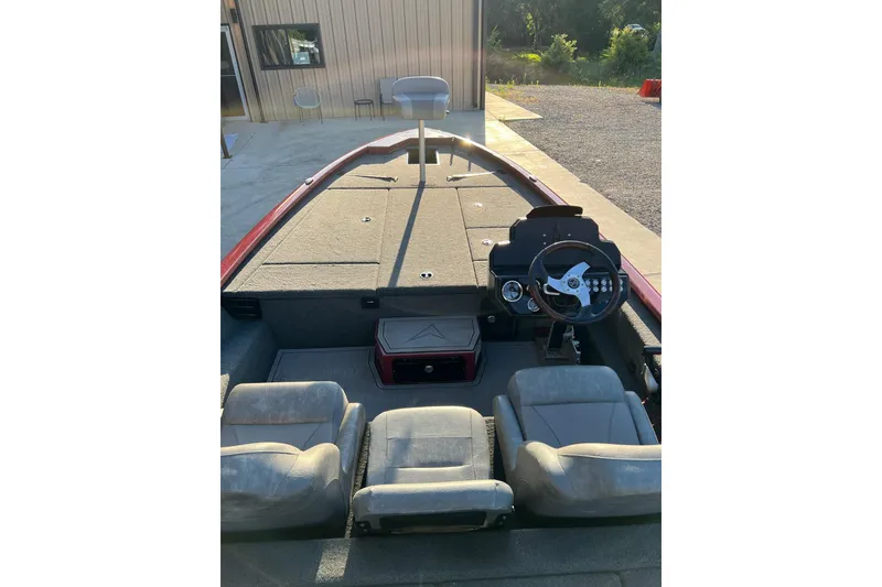 Slide: The Image of 2024 Avid 20 XB boat interior with steering wheel and seating. - 18