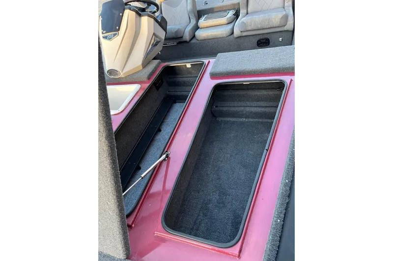 Slide: The Image of 2024 Avid 20 XB boat interior with open storage compartments and seating. - 25