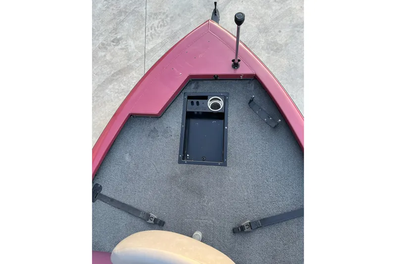 Slide: The Image of 2024 Avid 20 XB boat deck with storage compartment and control lever. - 8