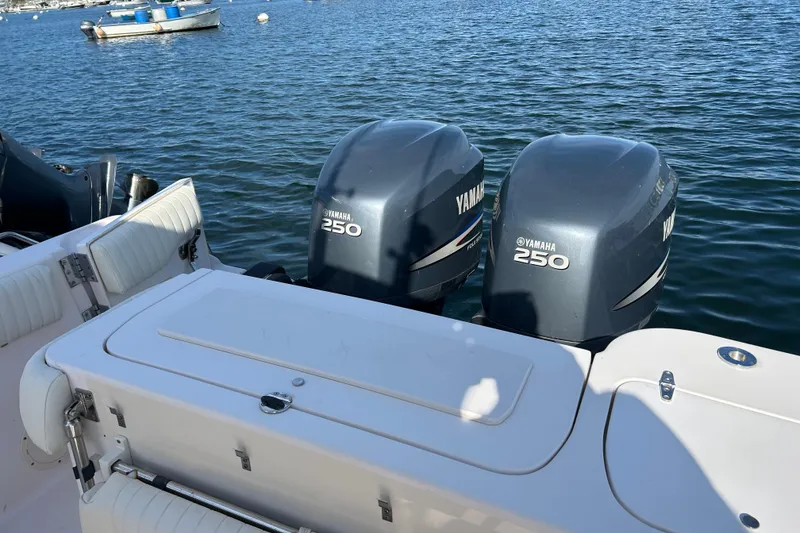 Slide: The Image of 2004 Grady-White Chase 273 boat with twin Yamaha 250 engines on water. - 13