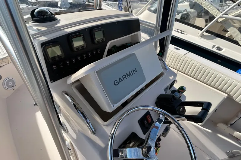 Slide: The Image of 2004 Grady-White Chase 273 boat dashboard with Garmin navigation system. - 7