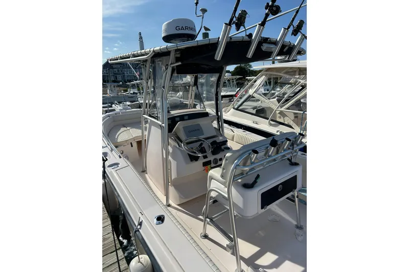 Slide: The Image of 2004 Grady-White Chase 273 boat with Garmin equipment, docked at a marina. - 9