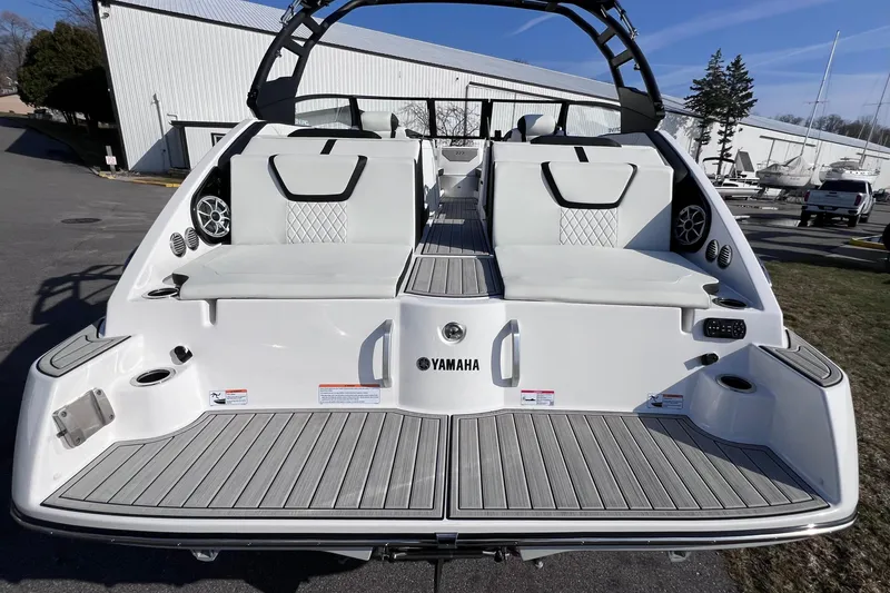 Slide: The Image of 2024 Yamaha Boats 222SD rear view, showcasing spacious seating and sleek design. - 11