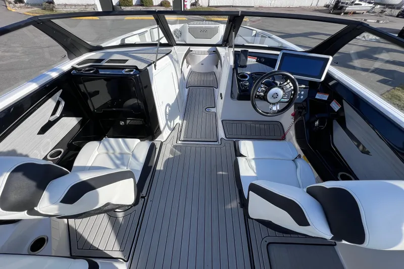 Slide: The Image of 2024 Yamaha Boats 222SD interior with modern helm and seating. - 16