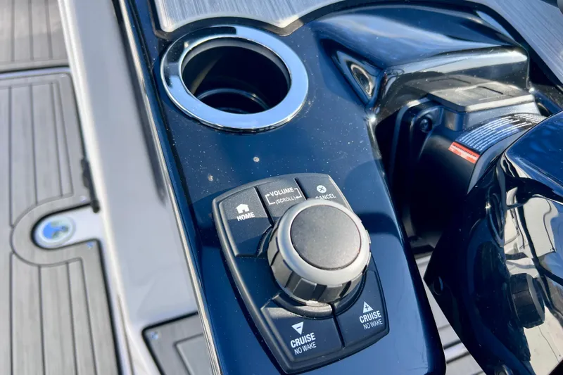Slide: The Image of 2024 Yamaha Boats 222SD control panel with cruise and volume buttons. - 19