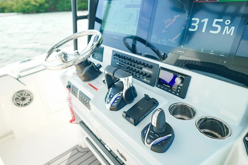 Slide: The Image of 2026 Cobia 305 Center Console dashboard with advanced navigation and control systems. - 15