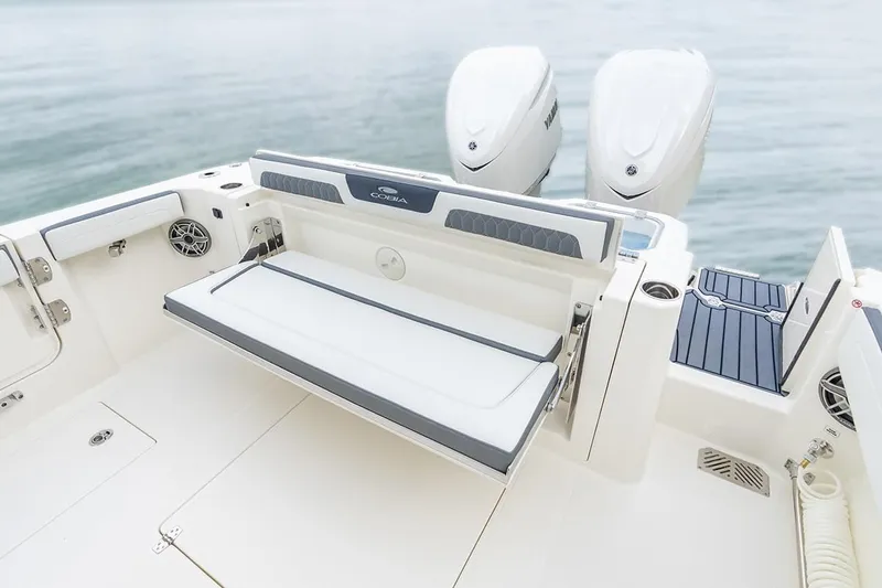 Slide: The Image of 2026 Cobia 305 Center Console boat with dual engines and foldable seating. - 3