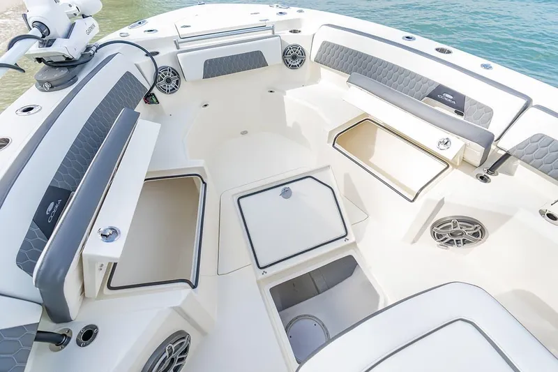 Slide: The Image of 2026 Cobia 305 Center Console boat interior with storage compartments and seating. - 34