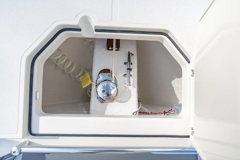 Slide: The Image of Anchor storage compartment on 2026 Cobia 305 Center Console boat. - 35