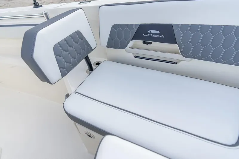 Slide: The Image of 2026 Cobia 305 Center Console boat seat with stylish gray and white upholstery. - 36