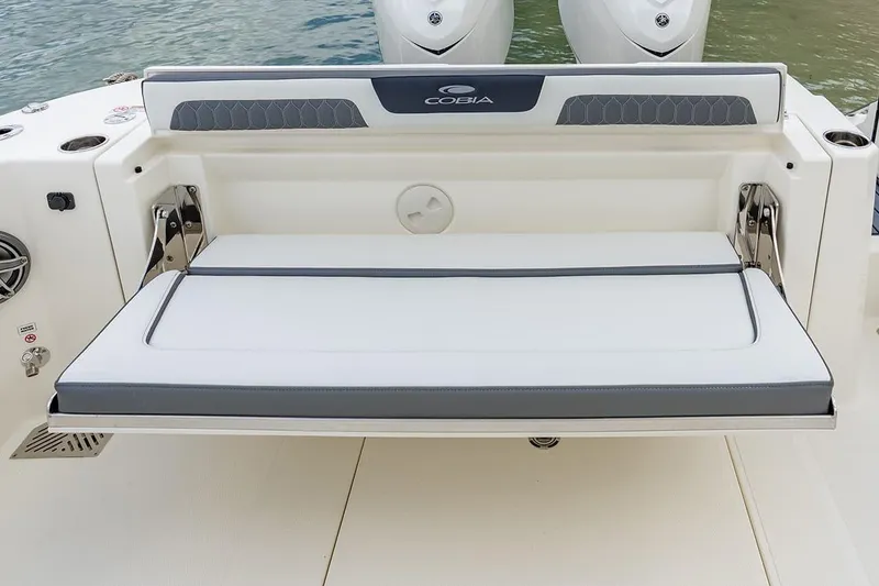 Slide: The Image of 2026 Cobia 305 Center Console boat with foldable rear bench seat. - 6