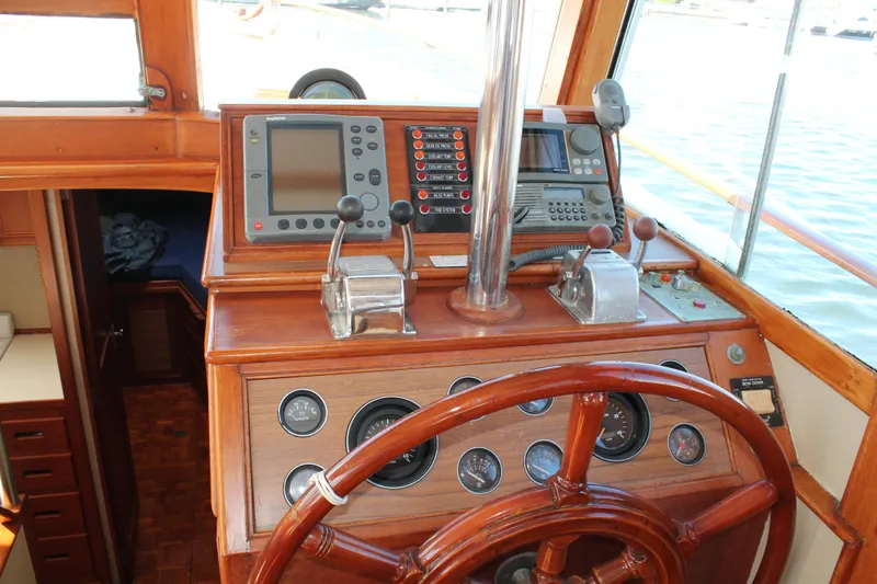 Slide: The Image of Helm of 1987 Grand Banks 42 Motoryacht with wooden wheel and navigation instruments. - 15