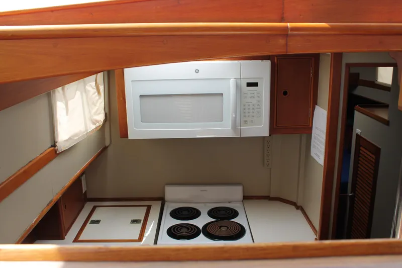 Slide: The Image of Galley kitchen in 1987 Grand Banks 42 Motoryacht with stove and microwave. - 18