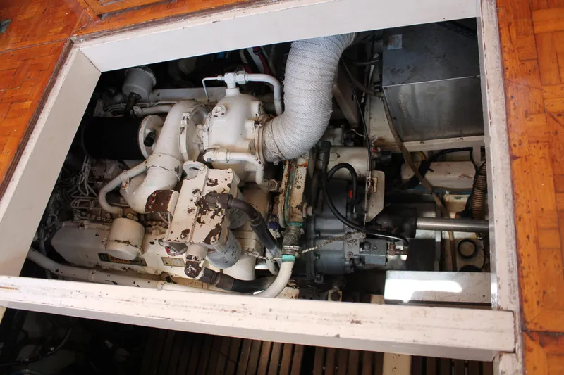 Slide: The Image of Engine compartment of a 1987 Grand Banks 42 Motoryacht, showcasing mechanical components. - 35