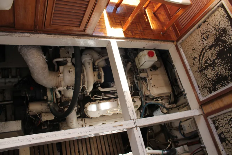 Slide: The Image of Engine room of a 1987 Grand Banks 42 Motoryacht, showcasing mechanical components. - 36