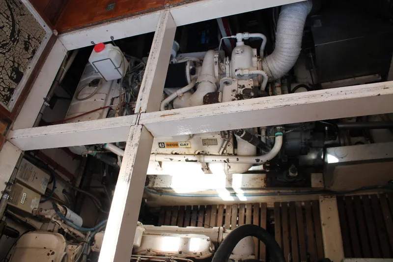 Slide: The Image of Engine room of a 1987 Grand Banks 42 Motoryacht with visible CAT 3208 engine. - 37