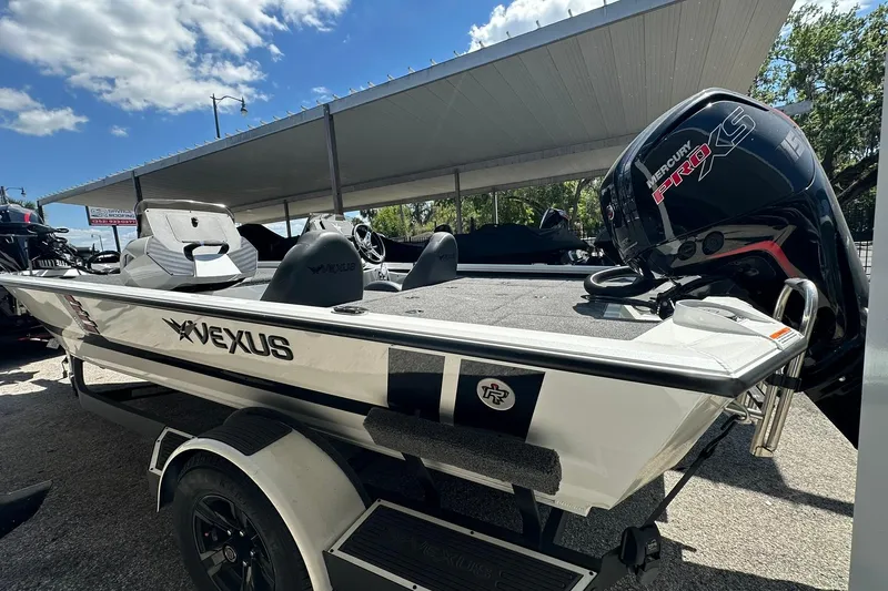 Slide: The Image of 2026 Vexus AVX1880 boat with Mercury Pro XS engine under a canopy. - 10