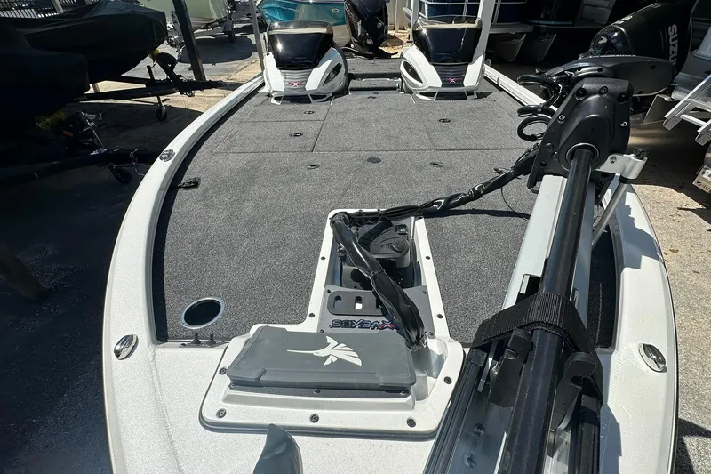 Slide: The Image of 2026 Vexus AVX1880 boat deck with trolling motor and storage compartments. - 11