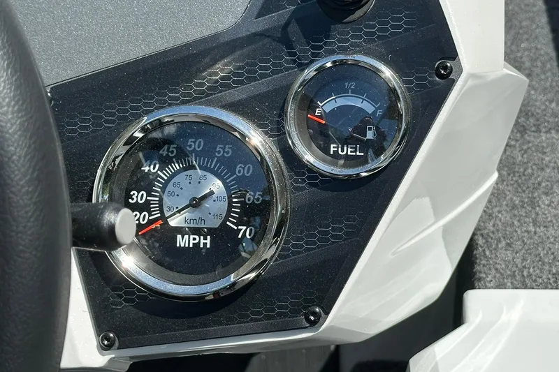 Slide: The Image of Dashboard of a 2026 Vexus AVX1880 boat showing speedometer and fuel gauge. - 17