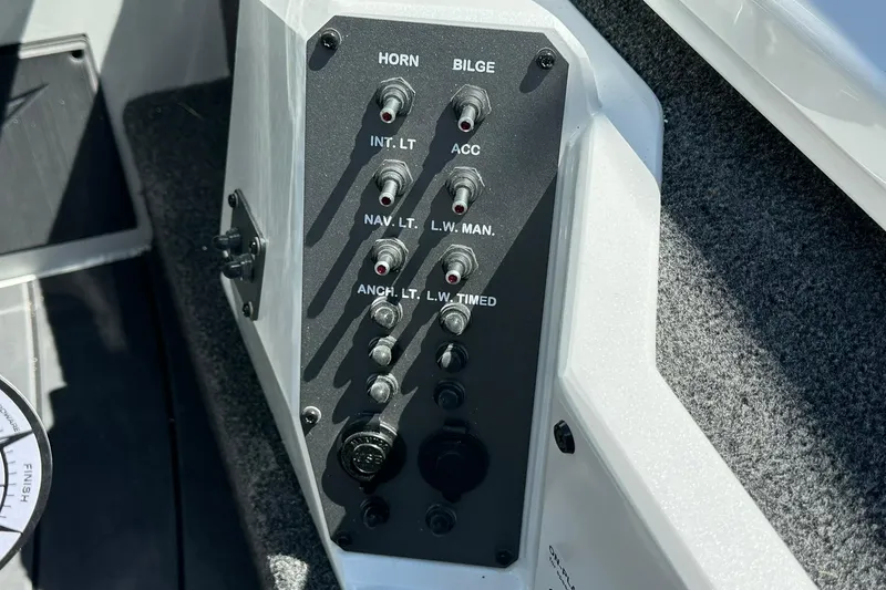 Slide: The Image of Control panel of 2026 Vexus AVX1880 boat with labeled switches for various functions. - 18