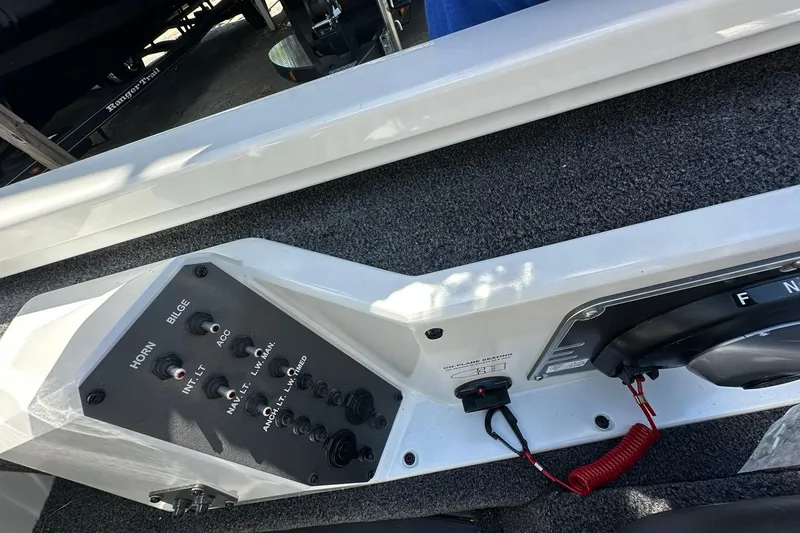 Slide: The Image of Control panel of 2026 Vexus AVX1880 boat with switches and steering wheel. - 19