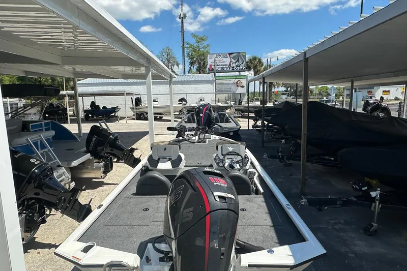 Slide: The Image of 2026 Vexus AVX1880 boat displayed in a covered outdoor showroom. - 25