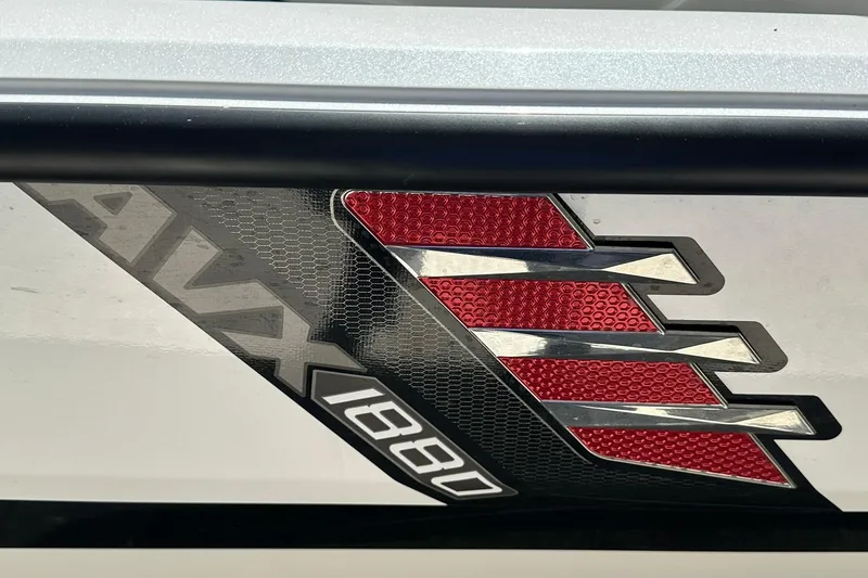 Slide: The Image of 2026 Vexus AVX1880 logo with red and black design elements. - 31