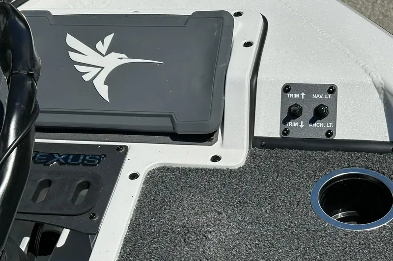 Slide: The Image of 2026 Vexus AVX1880 boat dashboard with control switches and logo. - 7