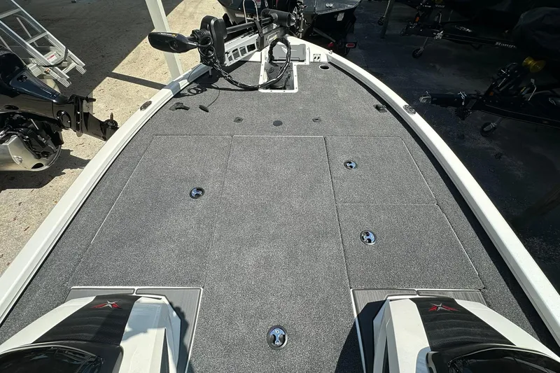 Slide: The Image of 2026 Vexus AVX1880 boat deck with carpeted surface and storage compartments. - 8