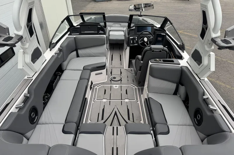 Slide: The Image of 2024 Supra SA 450 boat interior with sleek gray seating and modern dashboard design. - 5