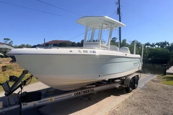 Slide: The Image of 2020 Robalo R242 Explorer boat on trailer, parked outdoors. - 5