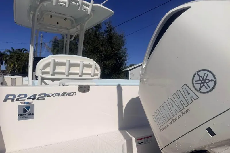 Slide: The Image of 2020 Robalo R242 Explorer boat with Yamaha engine, outdoor setting. - 7