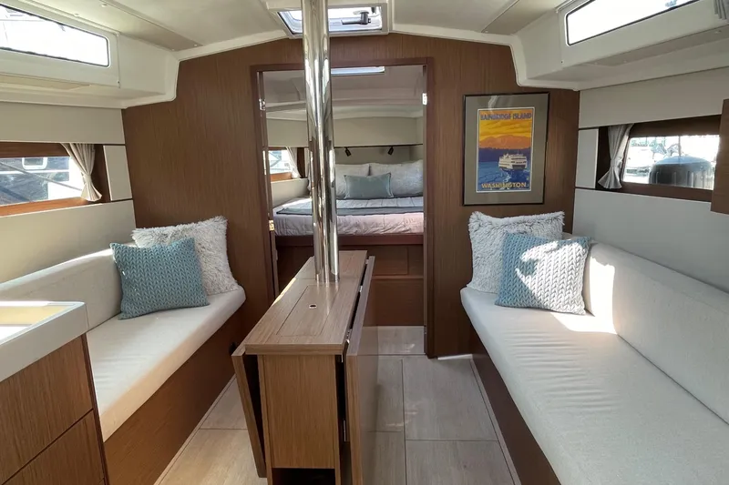 Slide: The Image of Interior of 2022 Beneteau Oceanis 38.1 sailboat, featuring cozy seating and modern design - 1