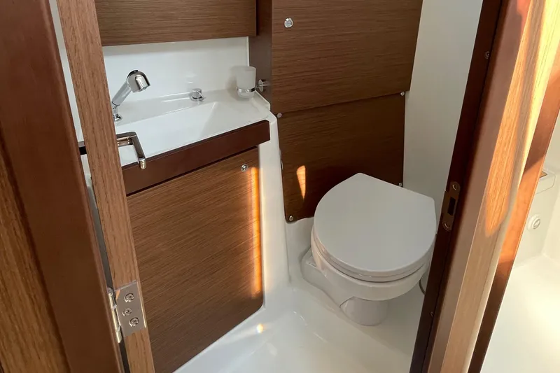 Slide: The Image of Beneteau Oceanis 38.1 2022 head with toilet and sink - 6