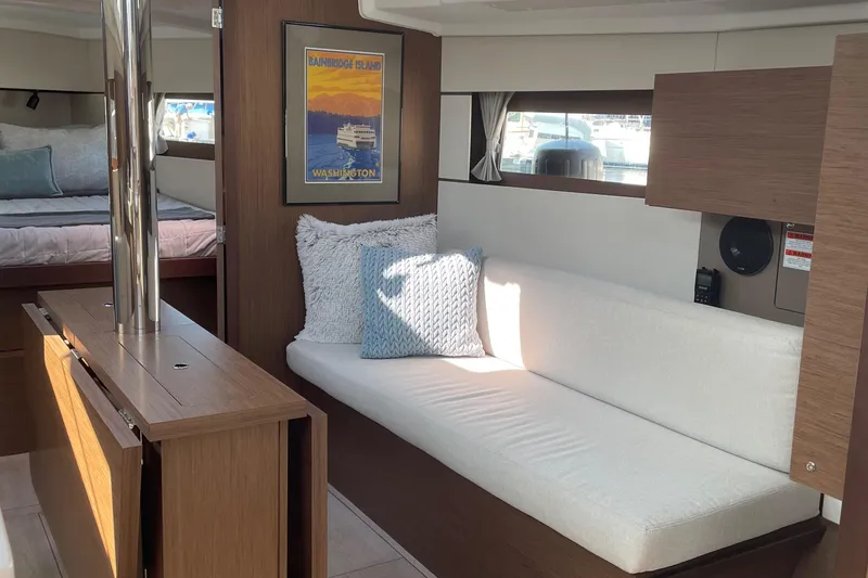 Slide: The Image of Interior of 2022 Beneteau Oceanis 38.1 yacht with cozy seating and modern design. - 8