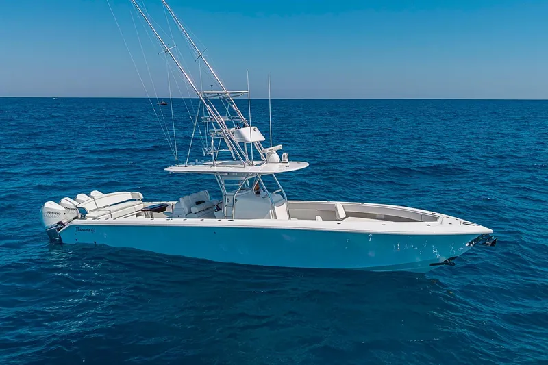 The Image of 2017 Bahama 41 boat on open ocean, featuring sleek design and multiple outboard engines. - 0