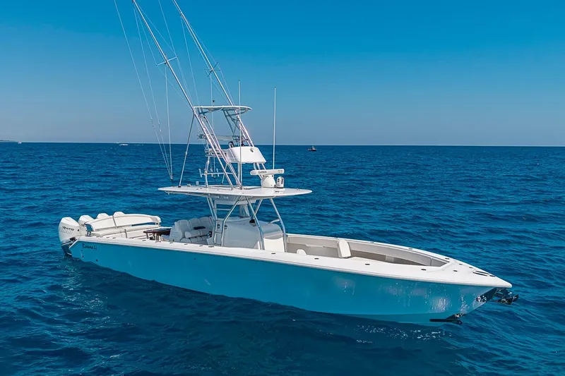 Slide: The Image of 2017 Bahama 41 boat on open sea under clear blue sky. - 2