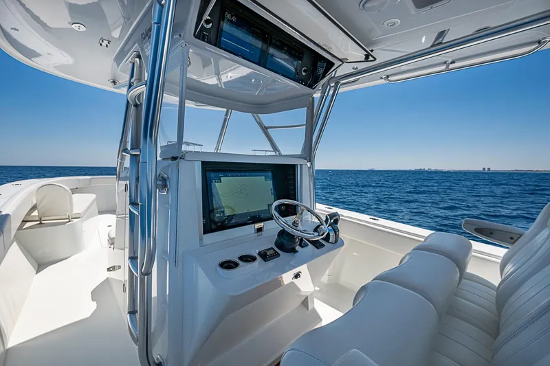 Slide: The Image of Center console of a 2017 Bahama 41 boat with advanced navigation system on open sea. - 25