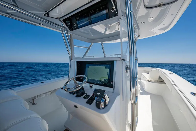 Slide: The Image of 2017 Bahama 41 boat cockpit with advanced navigation system on open sea. - 27