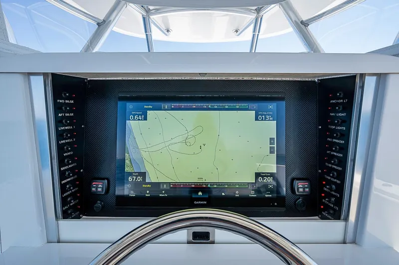 Slide: The Image of Control panel of a 2017 Bahama 41 boat with Garmin navigation display. - 28